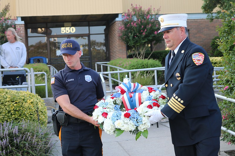 Ocean City Police Officer Jacob Harris and Deputy Fire Chief Tom Shallcross carry a wreath during the 9/11 ceremony in 2021.