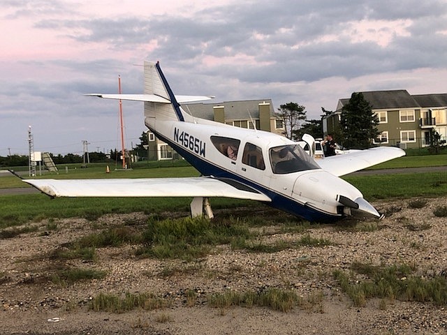 The single-engine plane sits nose down. 