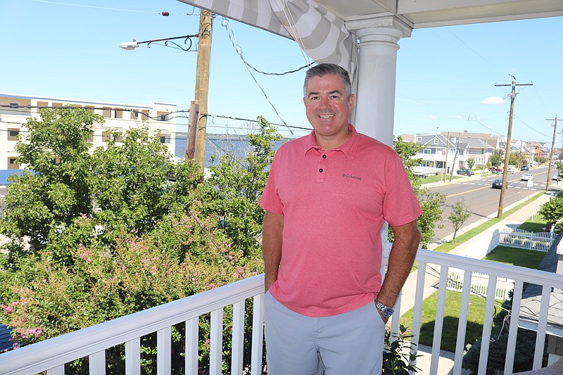 Terry Crowley Jr. stands on the deck of his Bay Avenue home.