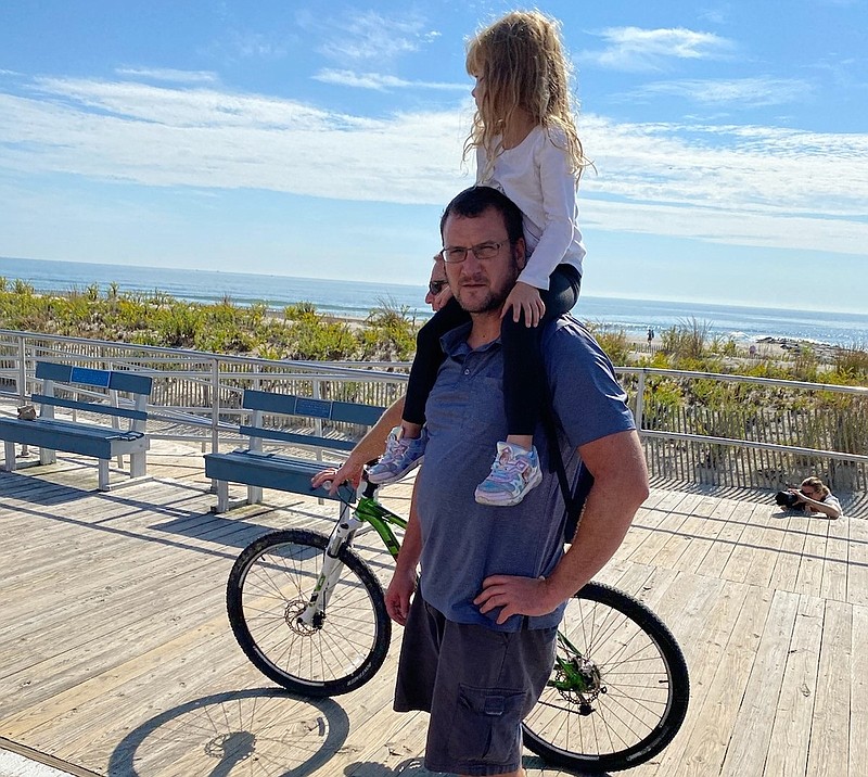 David, of Manahawkin, takes his daughter, Evelyn, for a stroll on the boards.