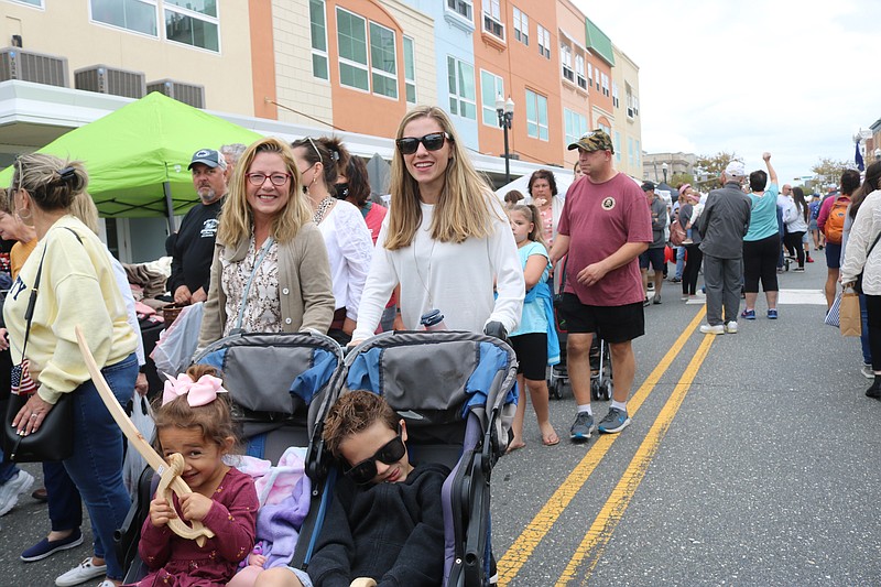 Rachael Tridente, of Ocean City, with her mom, Eileen Rocks, of Egg Harbor Township, push her children, Mia, 3, and 5-year-old CJ, down the avenue. 