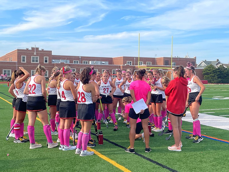 The team gets a pep talk during quarter intermission.