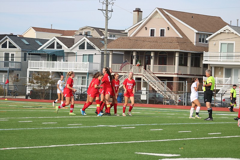 The Red Raiders celebrate one of their three goals against Clearview.