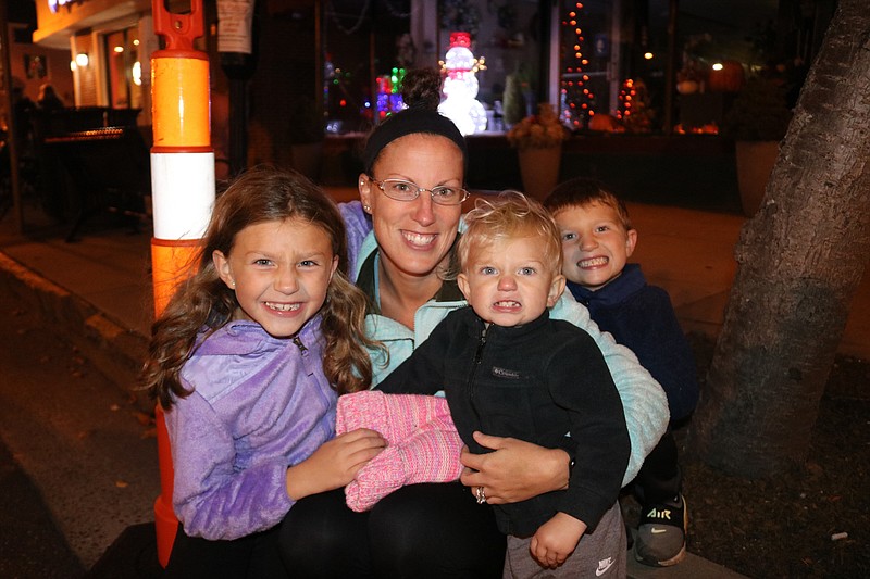 Suni Wood, of Marmora, with her children, Madilyn, 7, Madden, 1, and 4-year-old Mason anxiously await the floats.