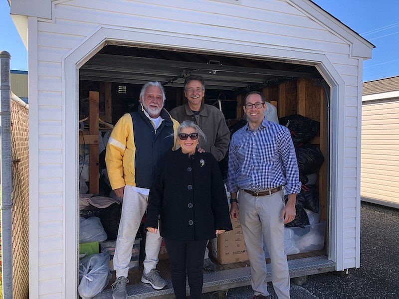 Realtors Nick Marotta, Kevin Best and Pete Madden, also an Ocean City Councilman, with Gloria Votta ready to make deliveries of the items.