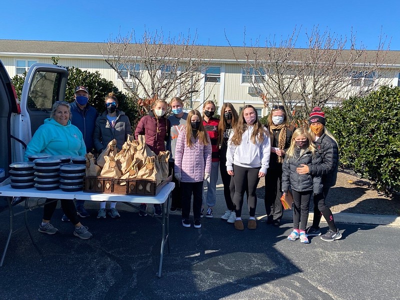 The team of volunteers stop at Wesley by the Bay to deliver meals.