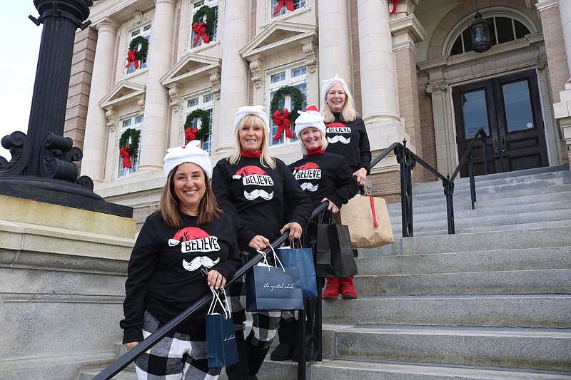 Sue Rowe, of Ocean City, Robbie Roselle, of West Caldwell, N.J., and Diane Young and Leta Strain, both of Ocean City, wear their matching pajamas while standing on the steps of City Hall.