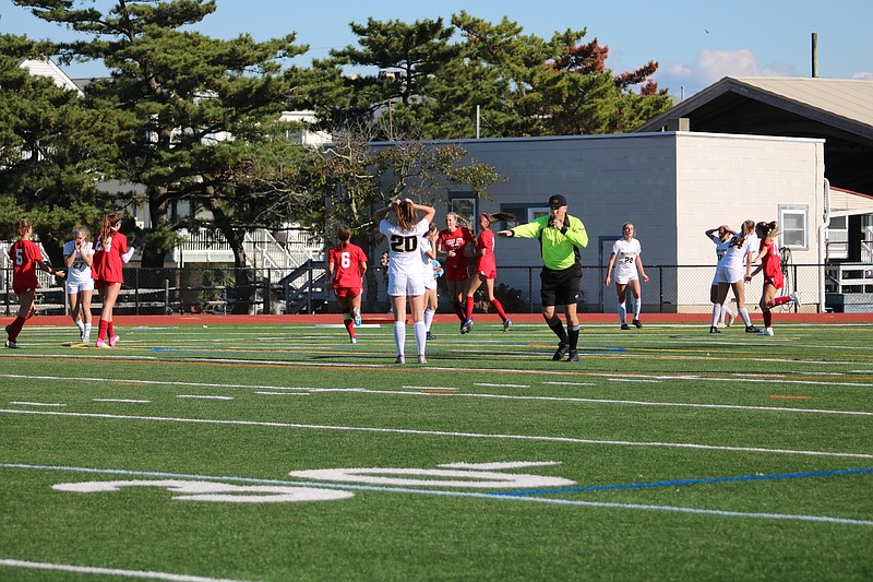 The Red Raiders celebrate the lone goal of the game off of Reimet (20).