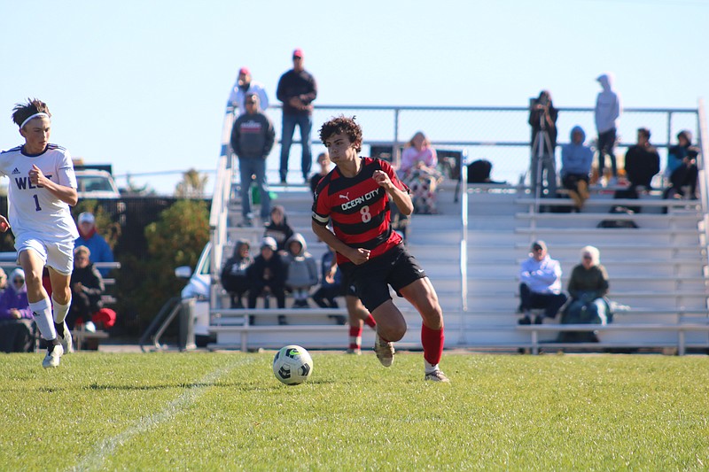 Ocean City Senior Chris Catona pushes the ball upfield.