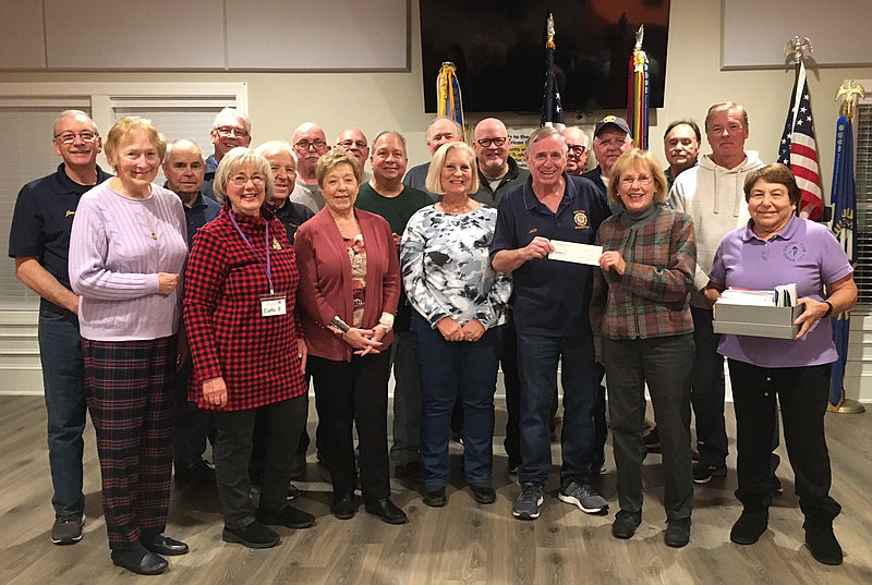 American Legion Dinner Program Coordinator Jack Hagan and Colony Club President Diane Root hold a donation check while joined by Colony Club members and American Legion Post 524 Dinner Program volunteers. (Photo courtesy of Doug Otto)