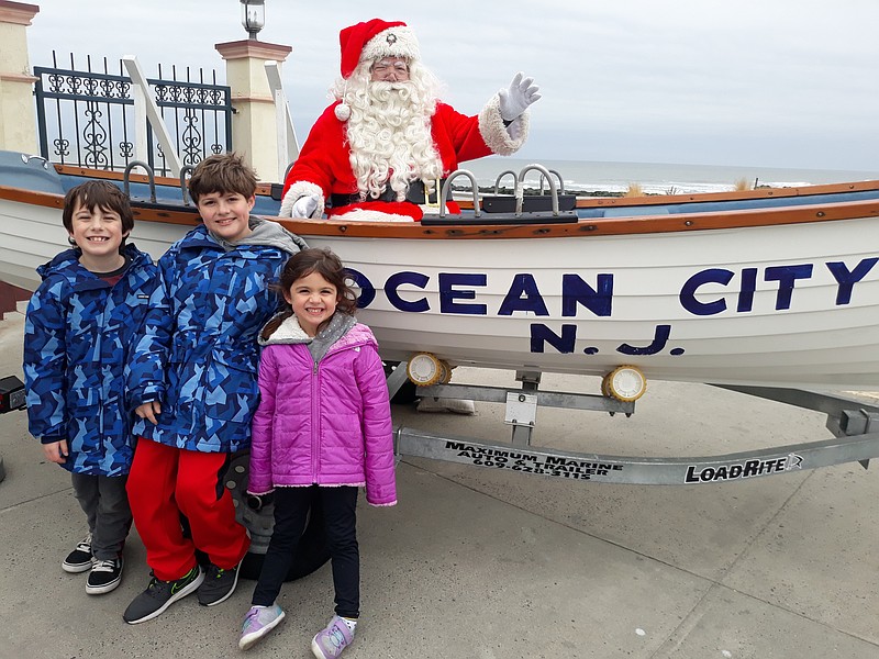 Children pose with Santa for holiday photos.