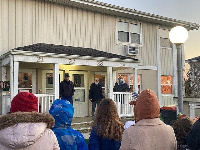 Residents listen to the students perform.