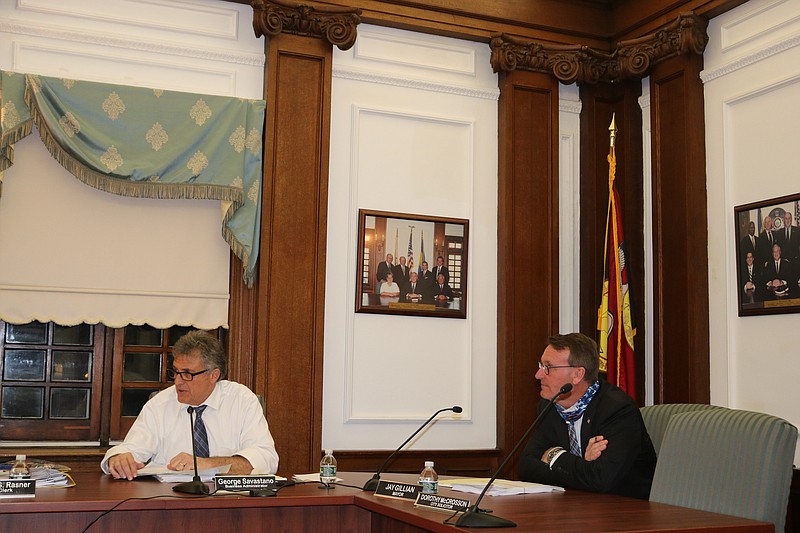 Mayor Jay Gillian, right, seated next to City Business Administrator George Savastano, tells City Council of his plans for a parking garage study.