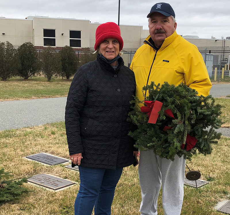 Cathy Solarski, Colony Club chair of the Wreaths Across America Committee, and husband Jim, prepare to place a memorial wreath on a grave at the Cape May County Veterans Cemetery. (Photos courtesy of Doug Otto)