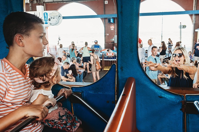 Lauren Gayeski photographs the Todd family, of Linwood, at Gillian's Wonderland Pier.