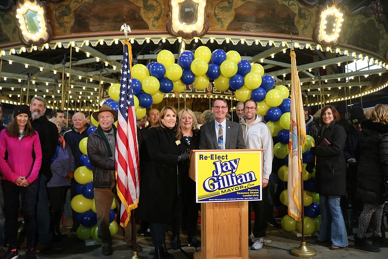 Gillian is joined by his wife, Michele, and some of his campaign supporters following his re-election announcement.