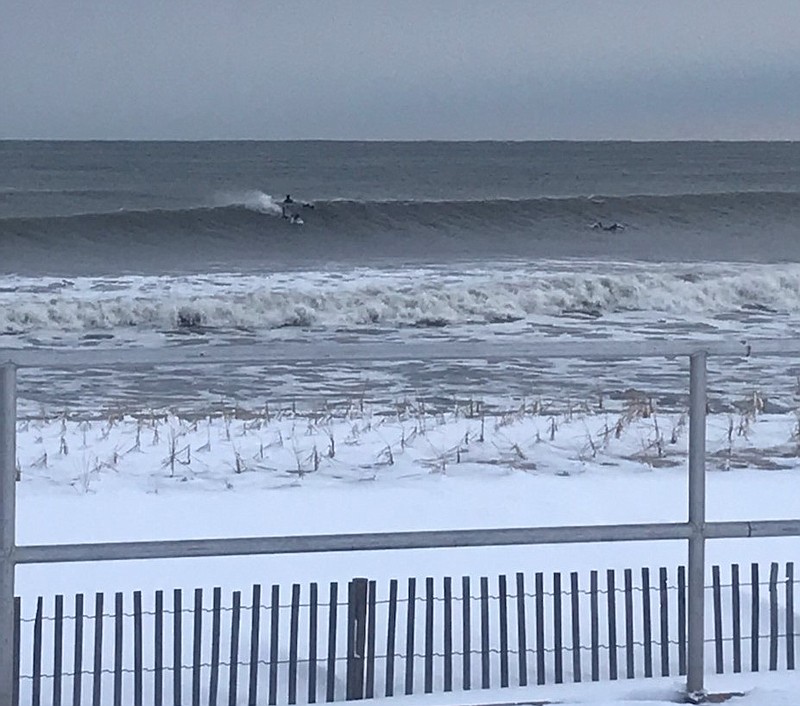 Surfers brave the icy water. (Photo courtesy of Ocean City)