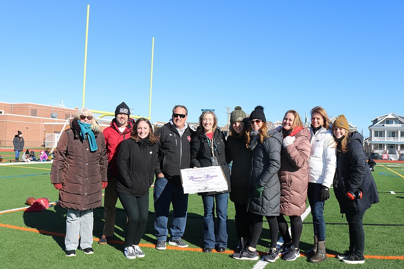 Teachers join in the fun with a group photo at Carey Stadium.