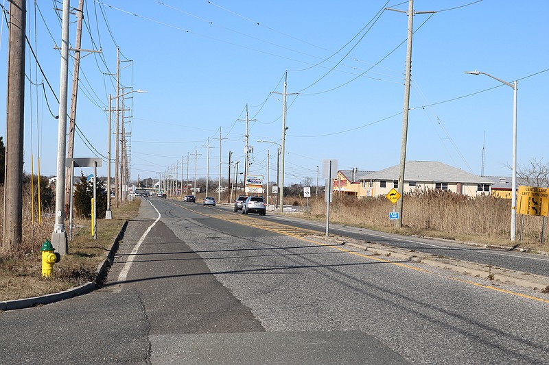 The low-lying road bisects the marshlands through the Marmora section of Upper Township.