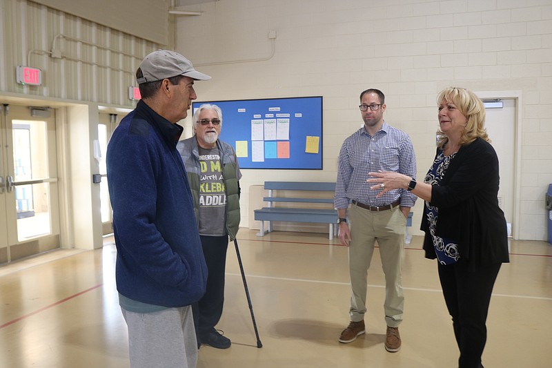 Council members Karen Bergman and Pete Madden speak with Ocean City residents Jess Gorman, in cap, and Keith Gesler.