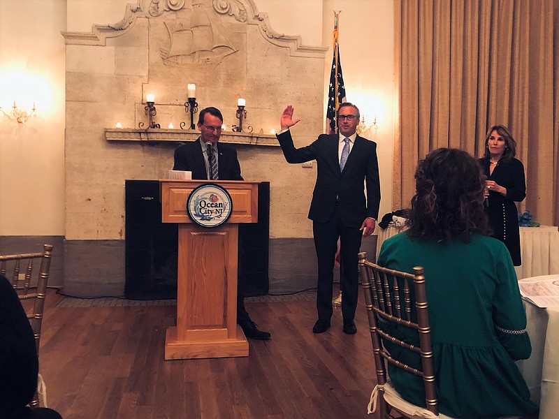 Mayor Jay Gillian swears in Billy McMahon as the new Chamber president.