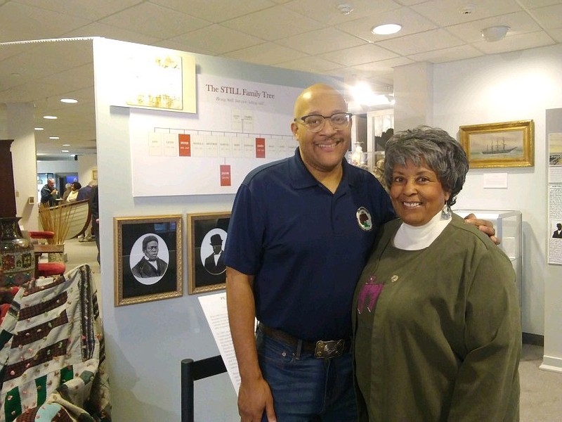 Samuel C. Still III and Ocean City resident and historian, Loretta Harris, stand in front of the display, which features notable Still family members of South Jersey.