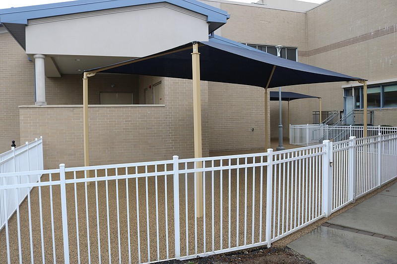 The outdoor space offers shade and a squishy rubber flooring for fitness classes and will soon also have new benches. 