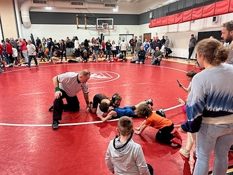 Action unfolds on the mat during the tournament.