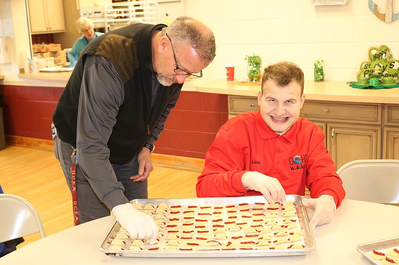 Tom Frederick, coordinator for W.A.V.E. works with student, Jules Sardinas, 21, of Ocean City. 