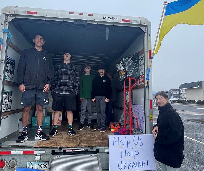 From left, Alec Wisnefski, Aidan Fasy, Brayden McAllister, Anderson Wisnefski and Anna Wisnefski help accept donations. 