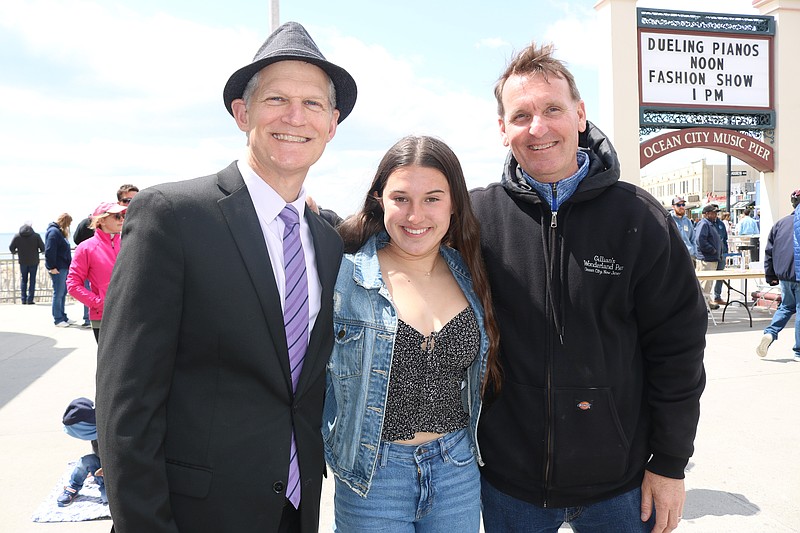 Michael Allegretto, aide to the mayor, daughter, Alexis and Mayor Jay Gillian share a light moment.