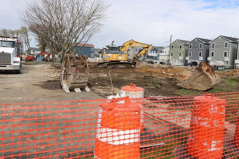 Construction rubble must be removed from the old Pecks Beach Village housing site before it is temporarily converted into green space.