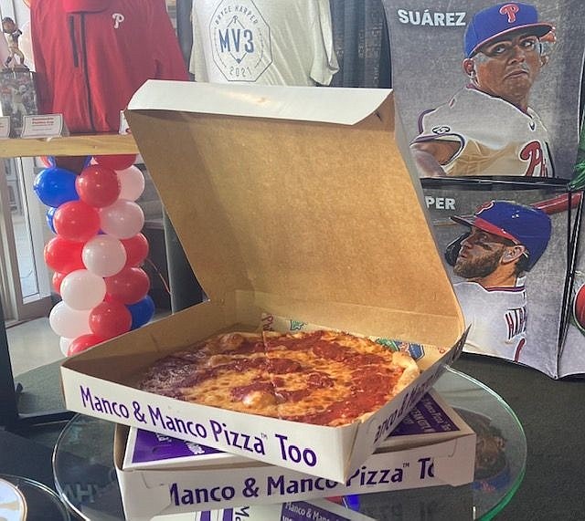 Boxes of Manco &amp; Manco pizza are showcased during the Phillies announcement.