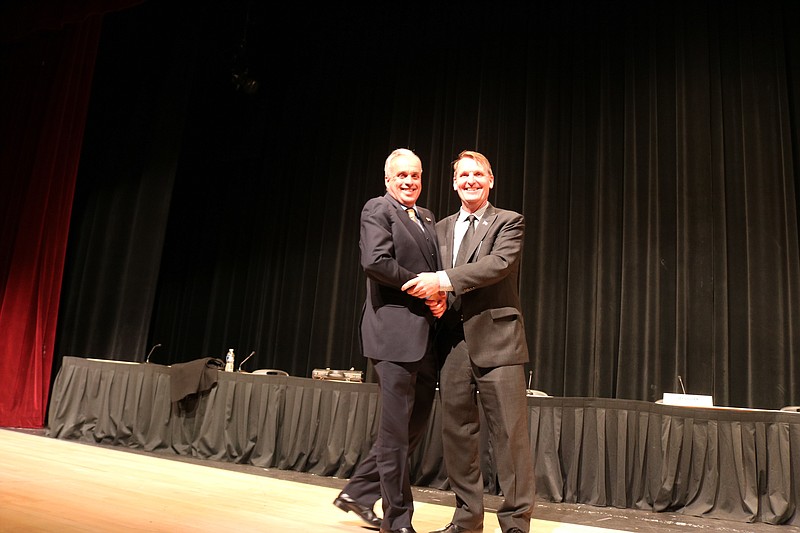 Election opponents Keith Hartzell, left, and Mayor Jay Gillian shake hands after the candidates' forum.