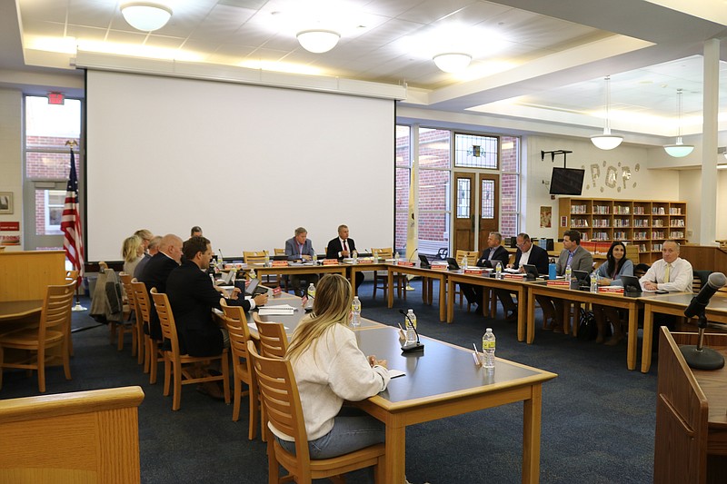 The Board of Education members listen as some parents speak about the girls head basketball coach during the April 27 meeting.