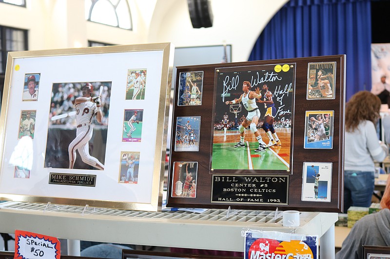 Autographed photos of sports stars are among the memorabilia for sale at the show.