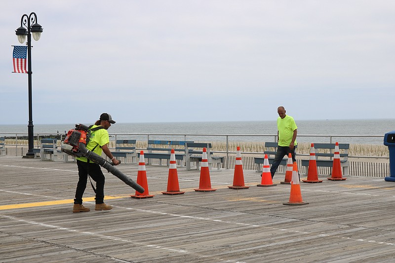 Workers install new boards in May 2022 before the height of the summer season.