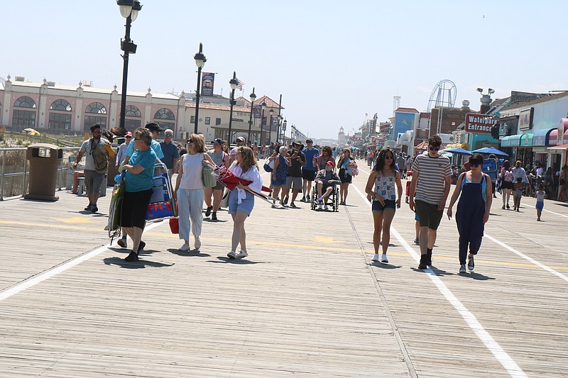 Visitors stroll on the Boardwalk on a busy Sunday afternoon.