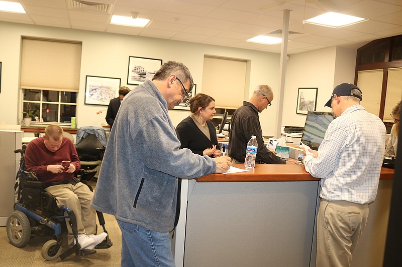 City employees count the votes as council members stand by Election Night. 