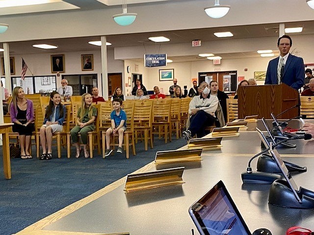 Dr. Friedman speaks at a Board meeting.