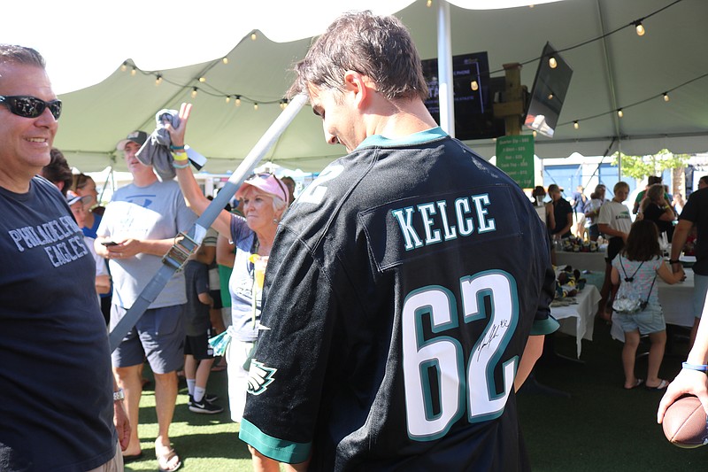 Connor Capizzi shows off Kelce's autograph on his No. 62 Kelce jersey.