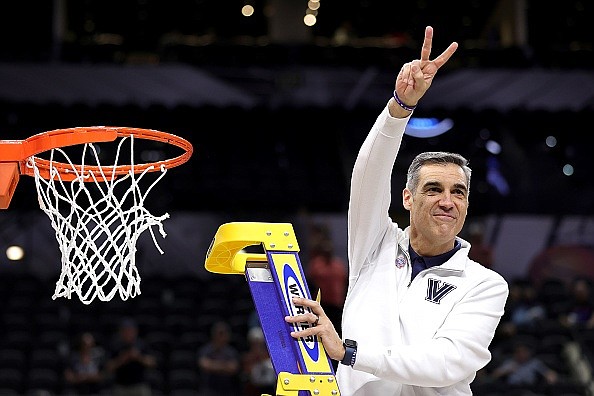 Villanova coach Jay Wright cuts down the net after the Wildcats defeated the Houston Cougars in the NCAA tournament in March. (Photo by Carmen Mandato/Getty Images)