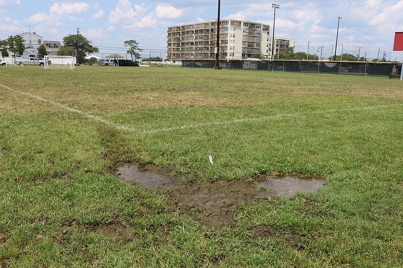 A mud puddle shows how the low-lying fields can become soggy at Grimes Field.