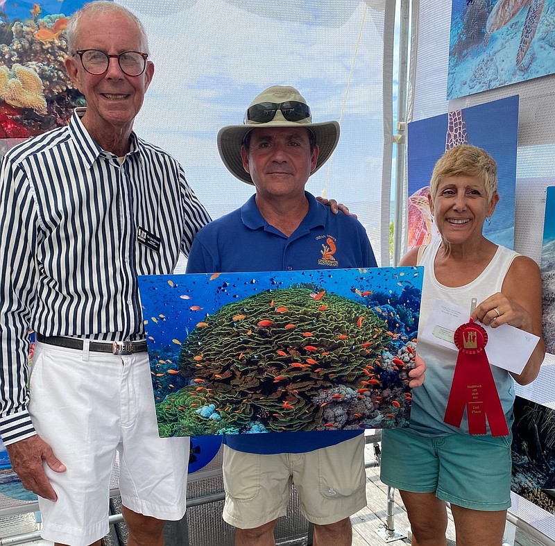 From left, Jack Devine with second place winner, David Del Biondo and his wife.