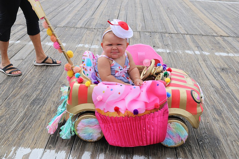 This cupcake cutie enjoys the 2022 Baby Parade.