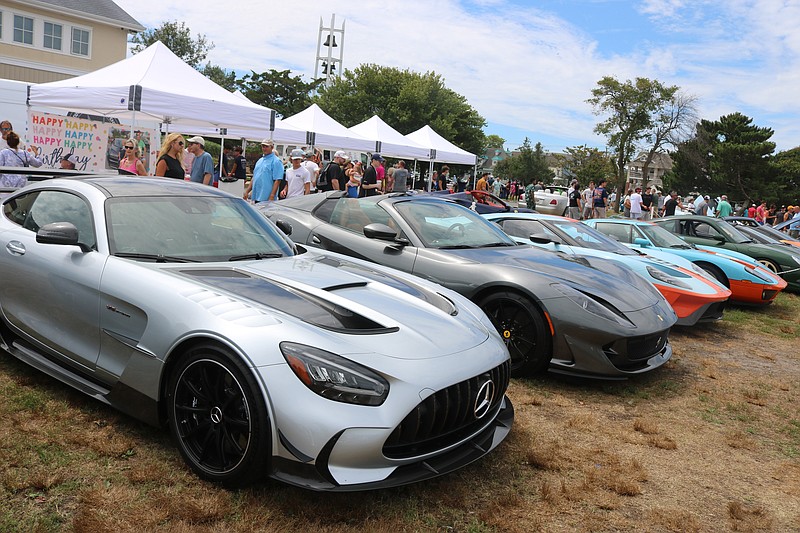 High end exotic cars and sports cars with major horsepower gave car lovers a lot to look at.