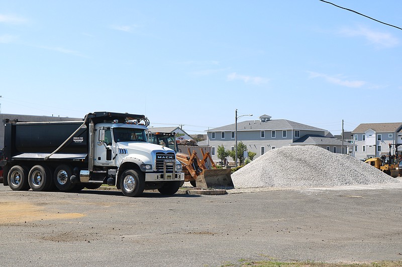 The site has been a construction zone with workers doing cleanup and gravel and dirt being trucked in over several months.