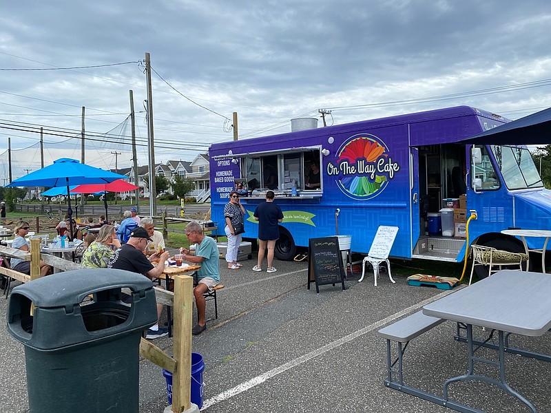 Tables set up next to the food truck offer outdoor dining. (Photo courtesy of Ocean City)