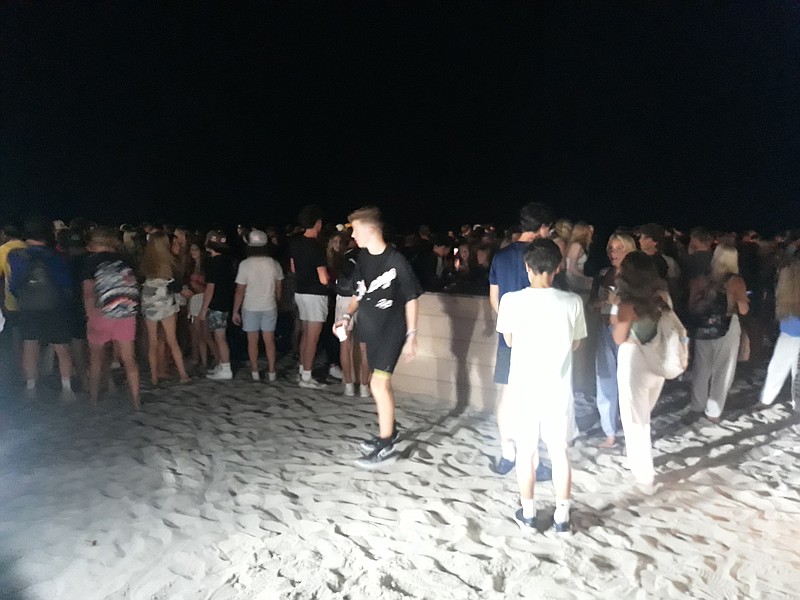 Groups of teenagers hang out on Ocean City's 11th Street beach on the night of Aug. 5, 2022.