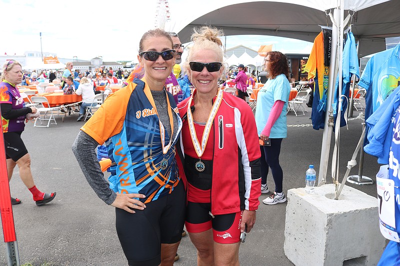 Barbara Anderson, who has MS, left, and Lynn Veenstra, celebrate their first Bike MS ride. 